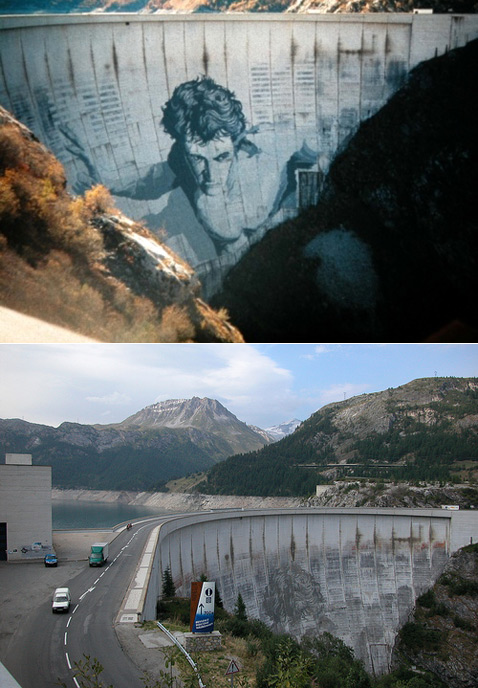 С первого взгляда трудно понять, что это за мужик. Но если присмотреться как следует, то в нём можно узнать Геркулеса. Высота дамбы составляет 181 метр, а ширина достигает 250. В наши дни, как видно по нижнему снимку, картинка уже порядком стёрлась, да и сама плотина смотрится не столь бодро (фото с сайта gosleepgo.com).