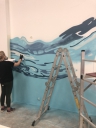 Процесс росписи стен в редакции RTVI и офисе «МаксимаТелеком»
